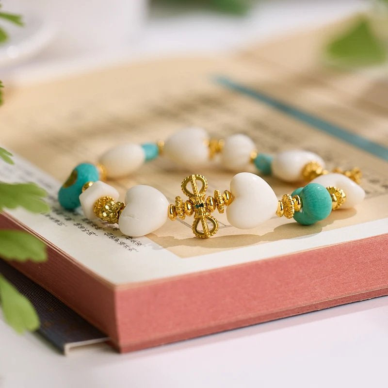 11–14mm Faux Ivory Deer Bone Peach Heart Bracelet | Vajra Pendant