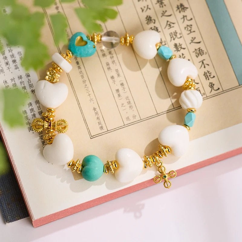 11–14mm Faux Ivory Deer Bone Peach Heart Bracelet | Vajra Pendant